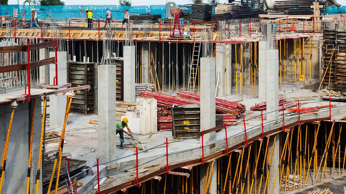 Workers on a multi-storey concrete construction site