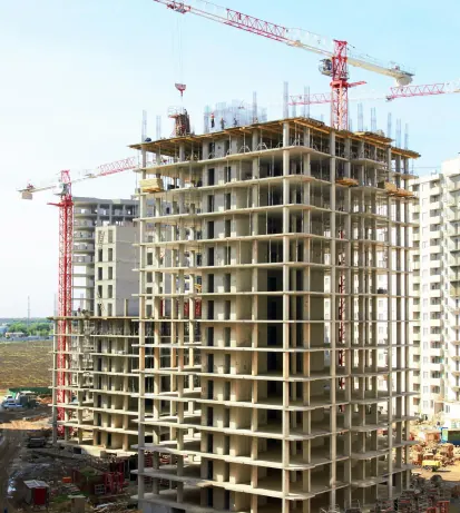 Multi-storey building under construction with a tower crane