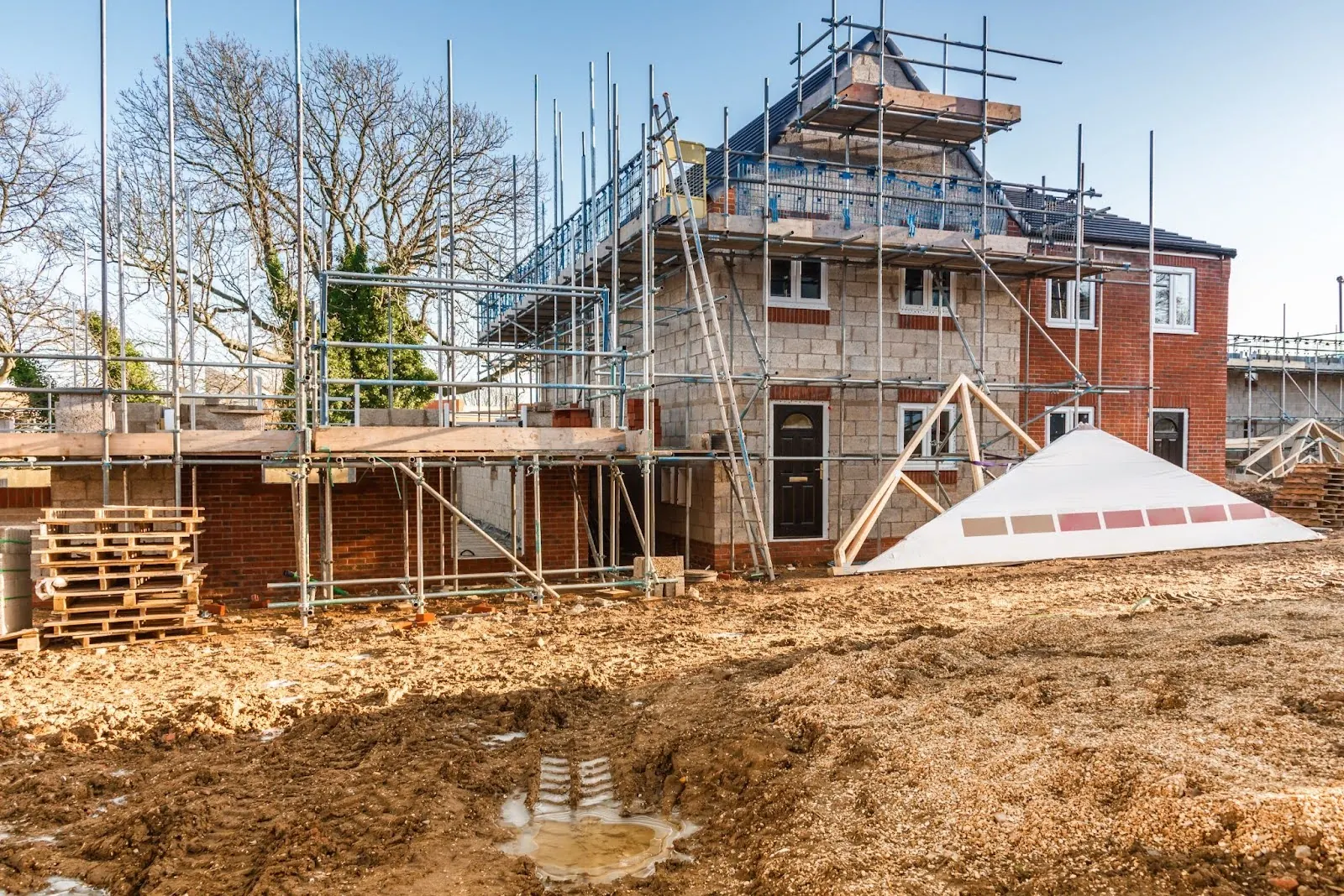 New house under construction surrounded by scaffolding